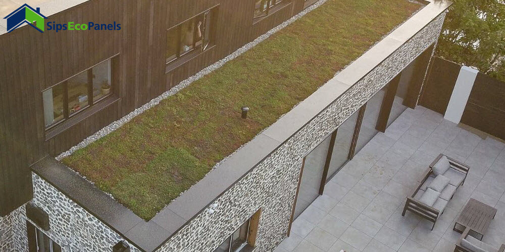 Ebony and flint cladding continues with green roofs to create a wildflower meadow